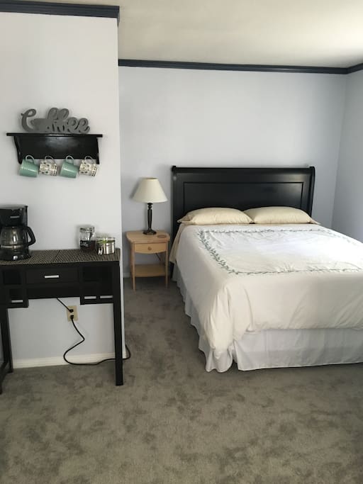Cozy queen bed with coffee nook