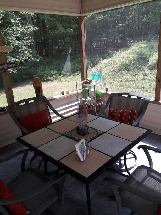 Indoor deck enclosed so bugs don't eat you while you're having martinis at night time