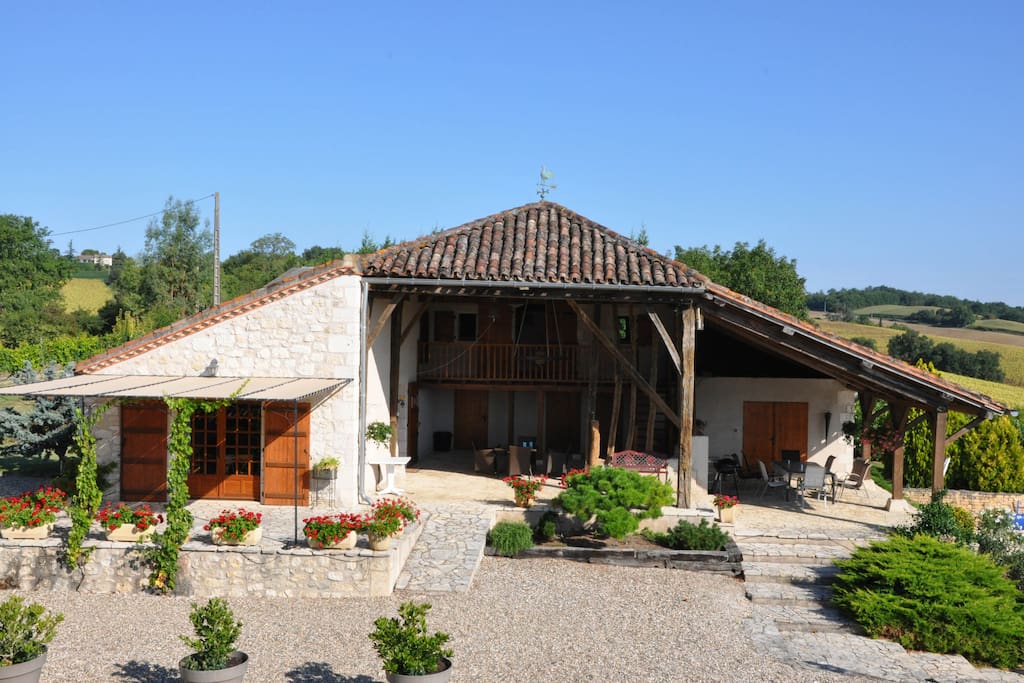 French doors on the left with a terrace open up the open plan living area. Lots of patio space!
