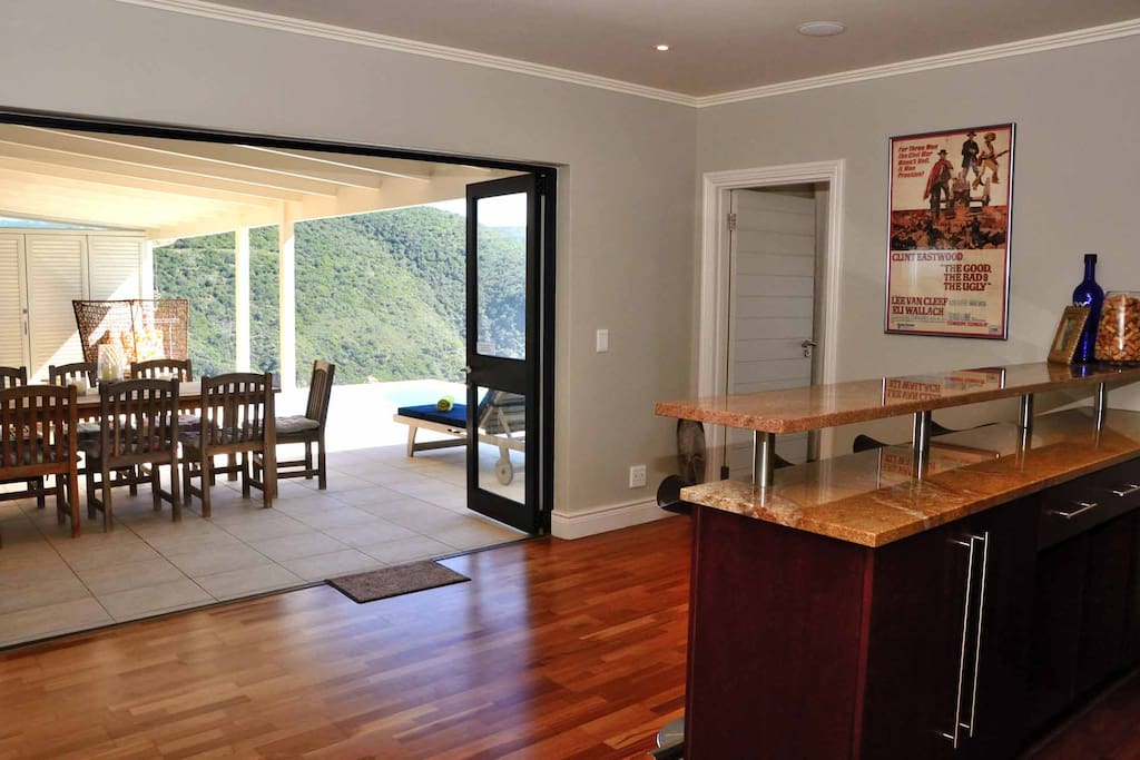 The generous bar - opens to the pool and outside braai area