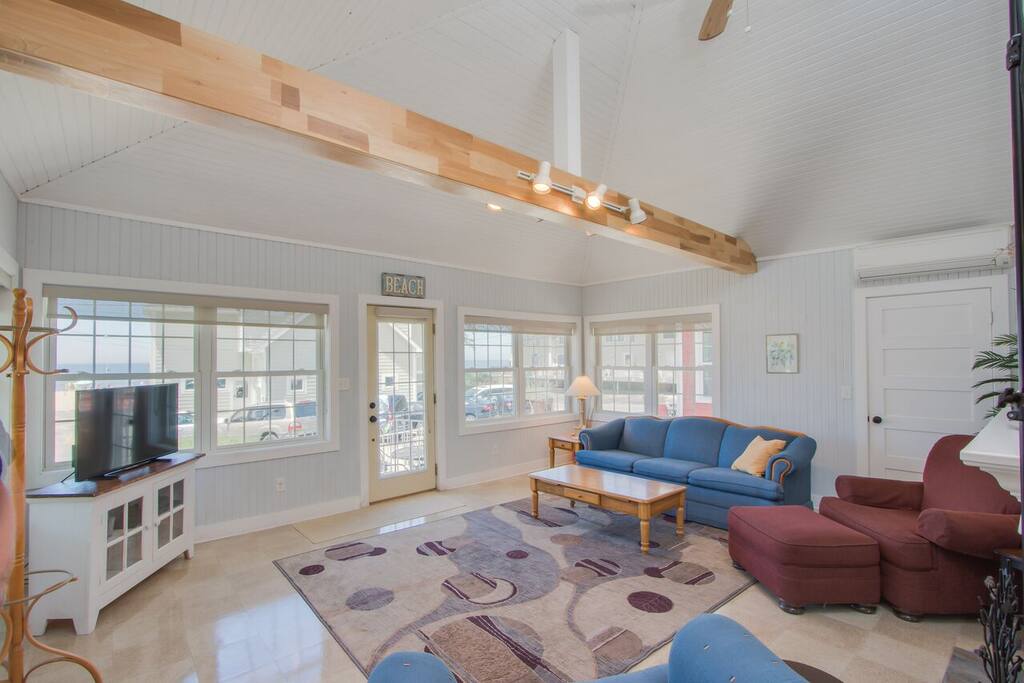 Living area with cathedral ceilings.
