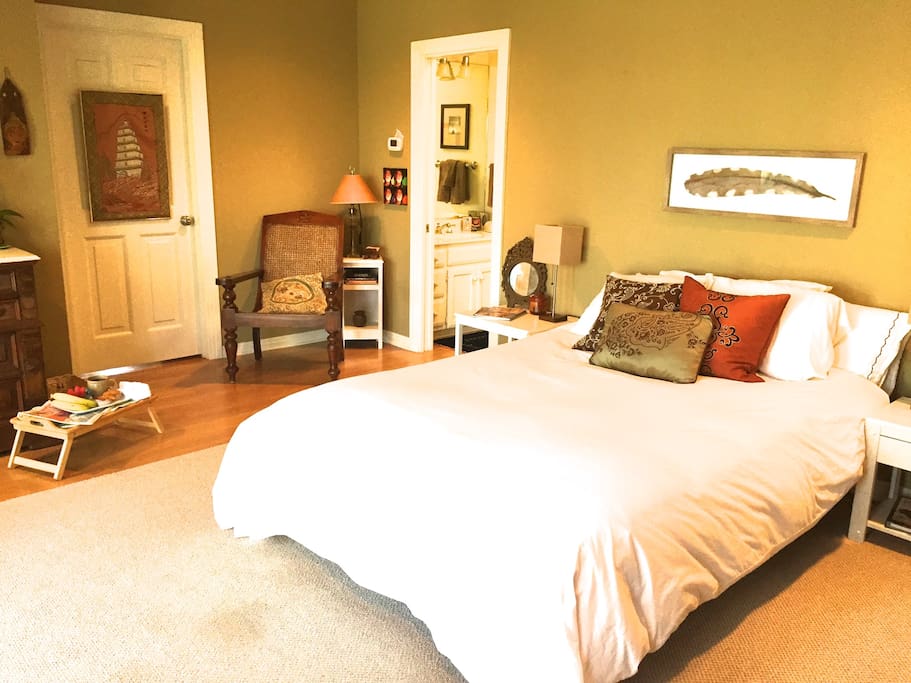Space room with sitting area and entrance to on-suite bathroom and walk-in closet and kitchenette.