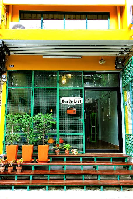 Hostel Exterior - Yellow building & Green gate // 100 meters from the main road.