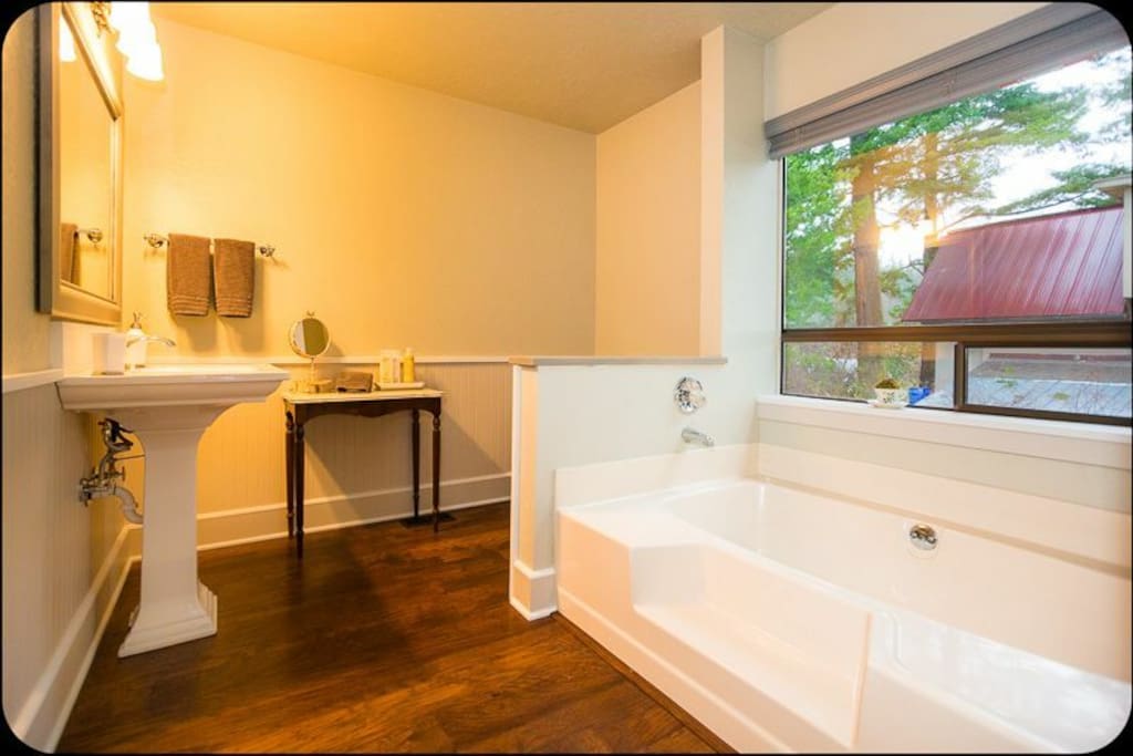 En-suite bathroom with soaking tub and standing shower