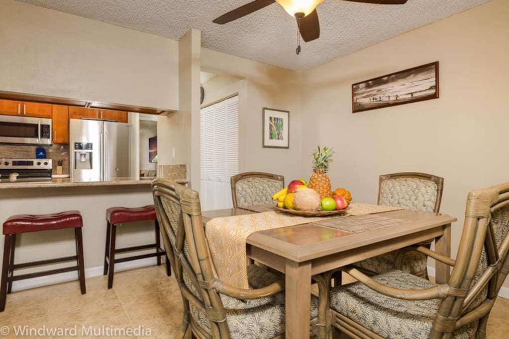 Dining table good for 4 guests with extra seating at the counter.