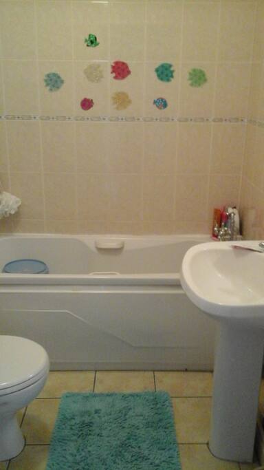 Bathroom with bath on the first floor.