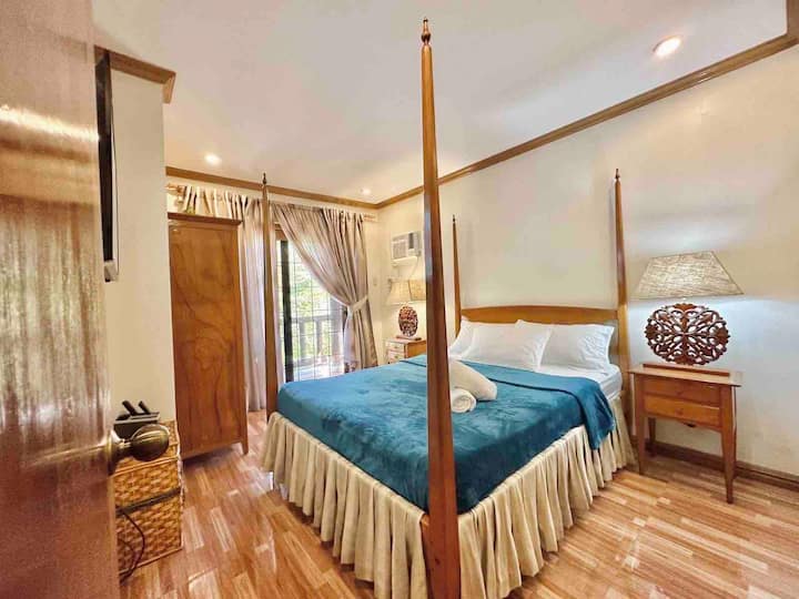 Master’s bedroom with queen size bed and own toilet and bath