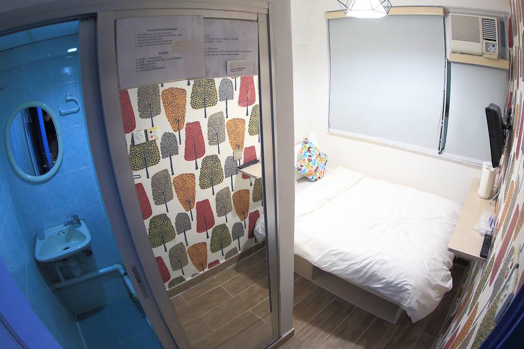 A toilet and a double bed
