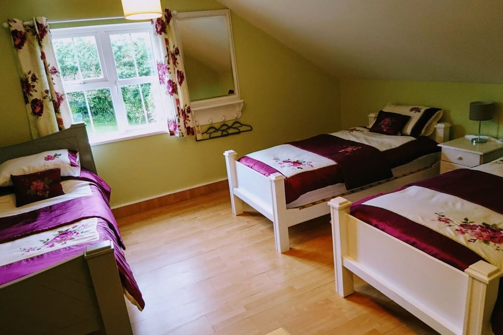 Loft bedroom/family room with one King size and two single beds