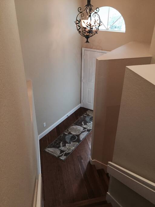 Front door entrance and inside entrance to garage