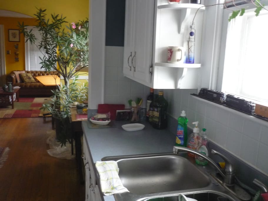 The kitchen looking to dining room and living room