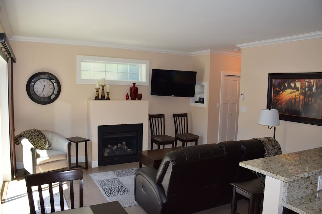 Smart TV with Netfix access and natural gas fireplace.