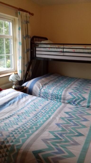 "1 Double and one bunk with double on bottom and single top.