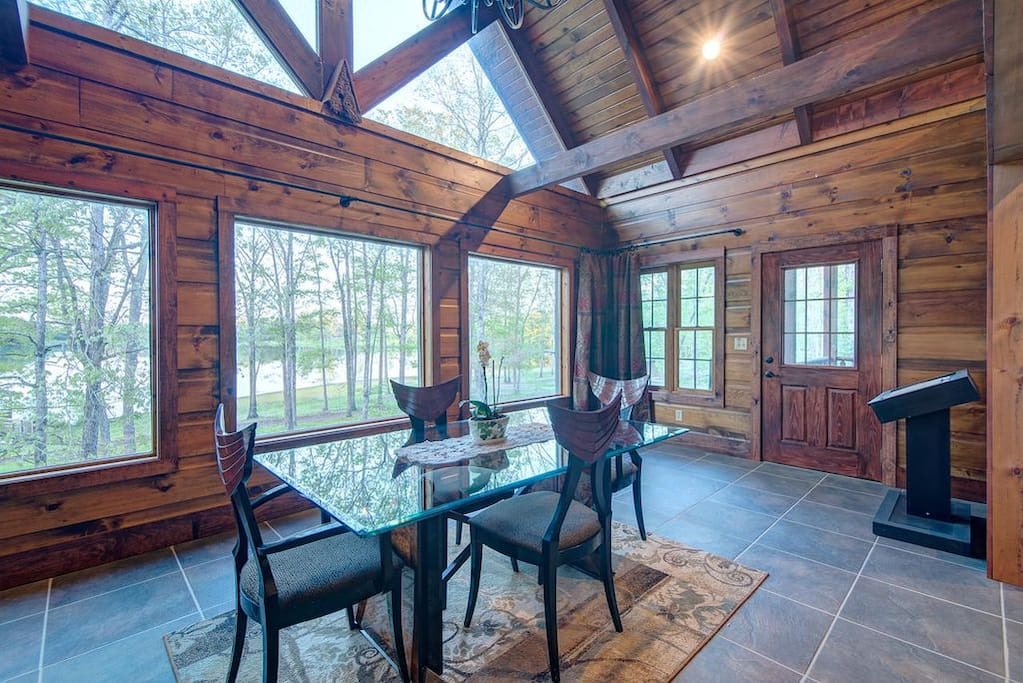 The dining room with floor to ceiling view of the lake!