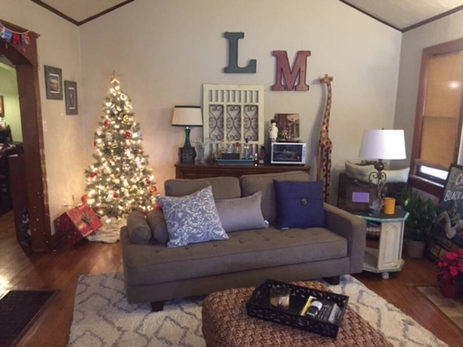 Front door entrance: Living room with tv and bar area