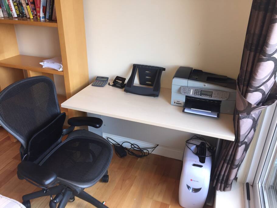 Home office together with ergonomic chair.