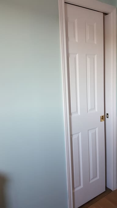 The Bayview Room features its own pocket door access to the shared bath.
