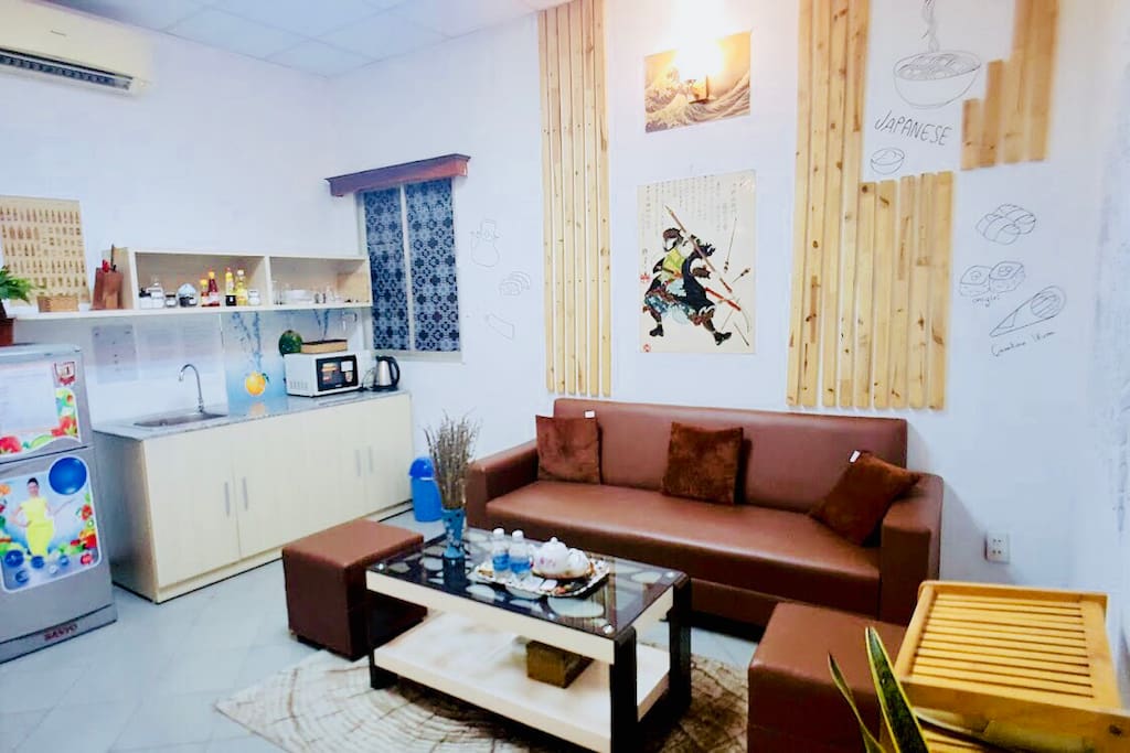 Your apt will have 2 big rooms: 1 living room, 1 bedroom and 1 bathroom. This is the living room with full amenities kitchen to make a delicious meal for your friend.