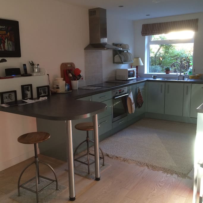 Open plan kitchen leading to dining and seating areas