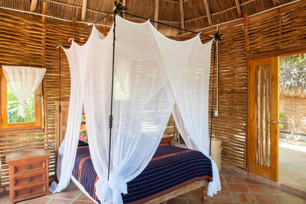 Comfy queen size bed with cotton mosquito net