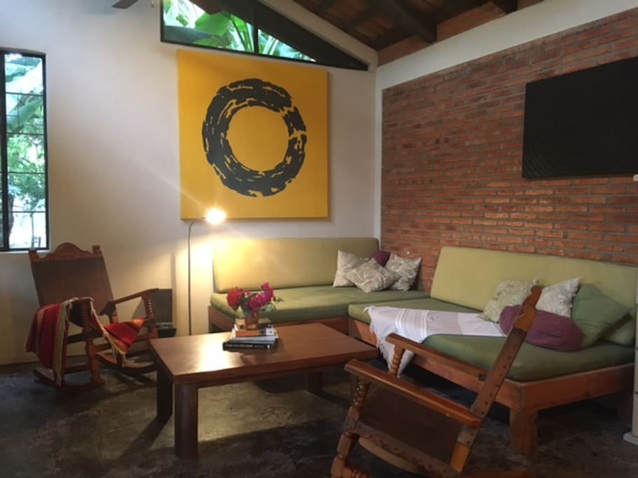 Two of three couches/daybeds in the living area.