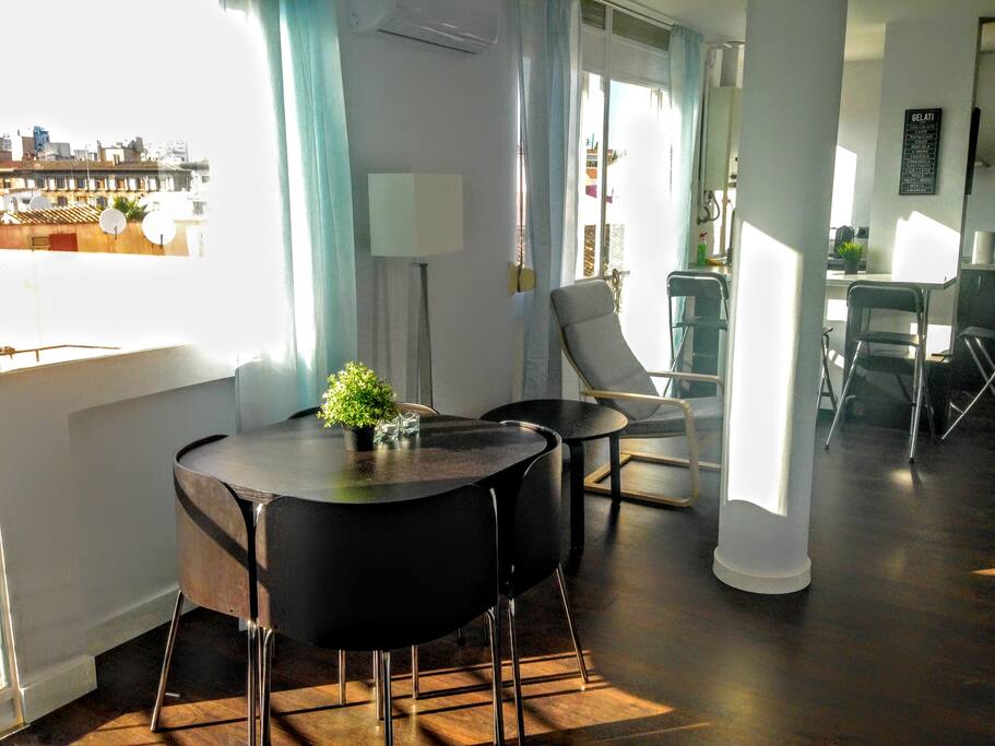 Dining area with one of the balconies in the living room