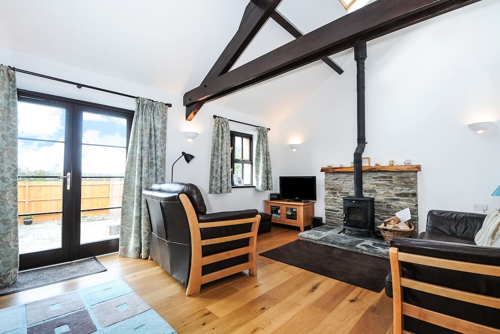 Comfortable, spacious lounge with cosy log burner