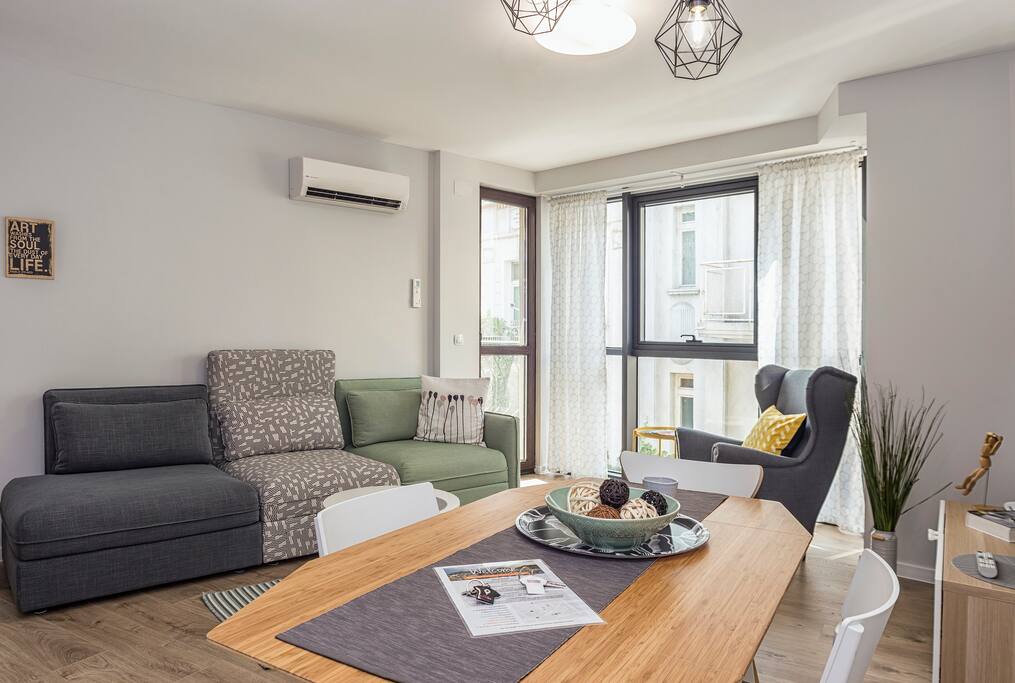 Living room with an open kitchen and dining area