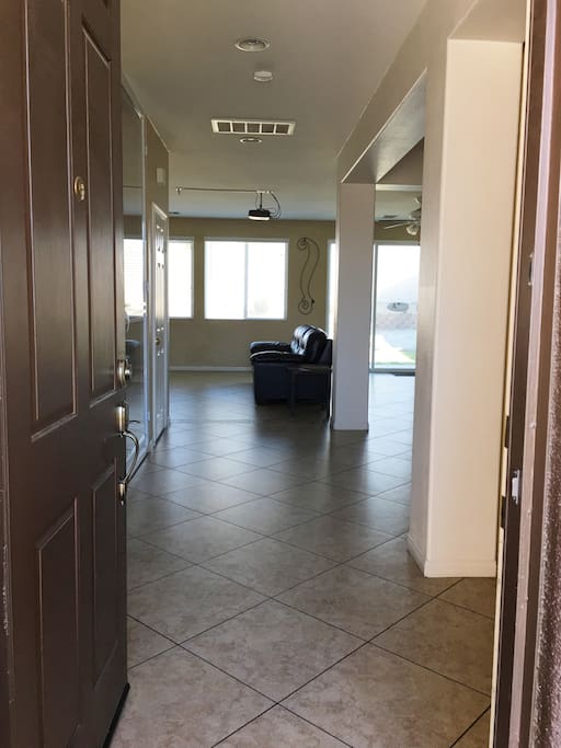 Front entry doors leads you to a large open floor plan with back yard views.