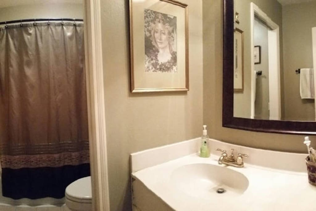 Full bath with tub and shower. If there is a guest in the other room, this would be a Shared space. There is another half bath available for your use.