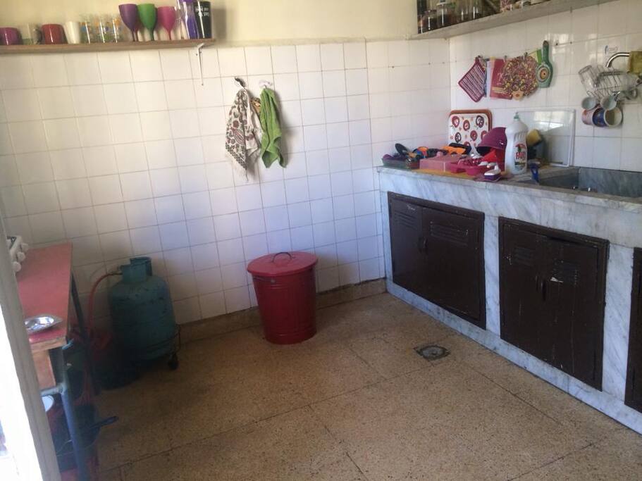Kitchen, gas stove to the left.