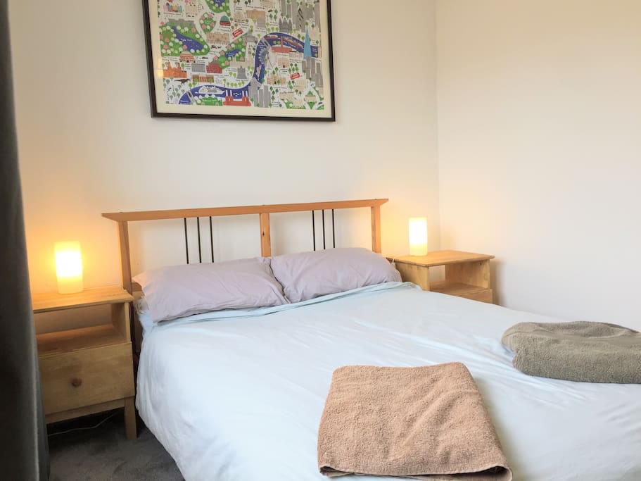 Storage in bedside tables and wardrobe