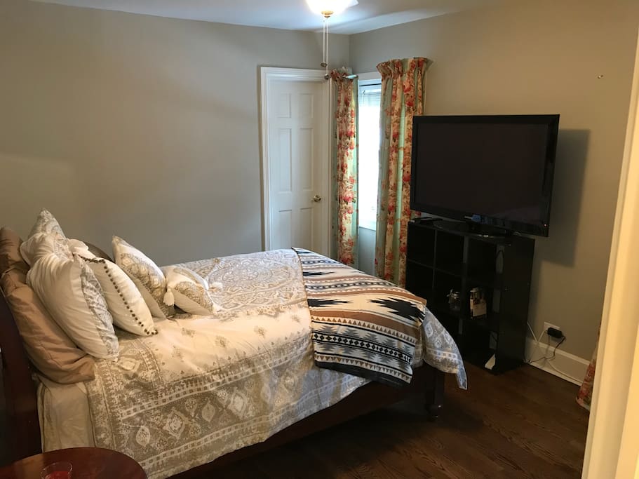 Cozy guest room with comfy full size bed and big HD TV.