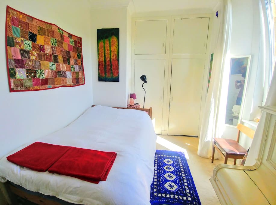 Bedroom wide angle photo with my original art