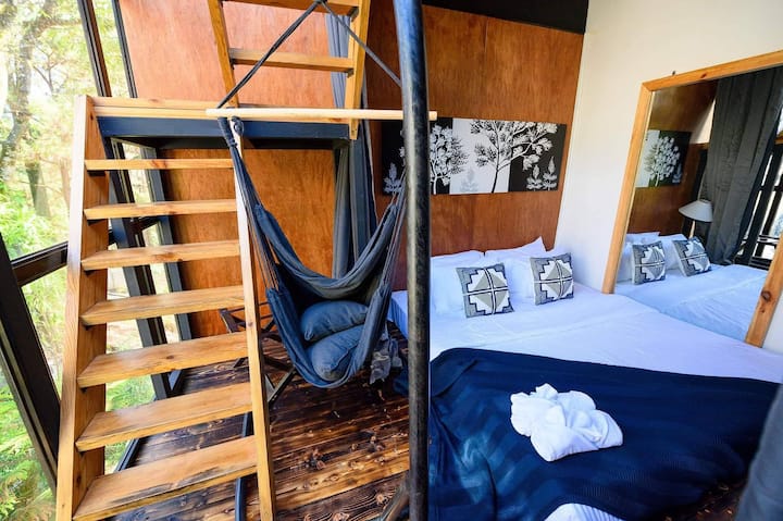 Let's take a look inside the Pine Needle Treehouse. This is the Lower Deck Bedroom of the Treehouse