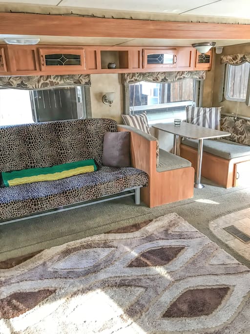 Futon Couch, Table seating and storage.
