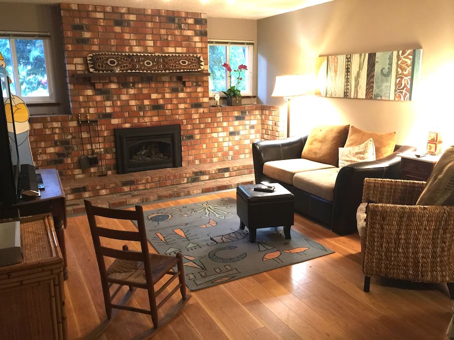 Large downstairs suite with comfortable living room with gas fireplace, LOTS of books and a 60" HD TV.