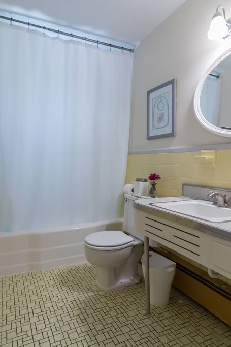 Bathroom w/ tub + shower.