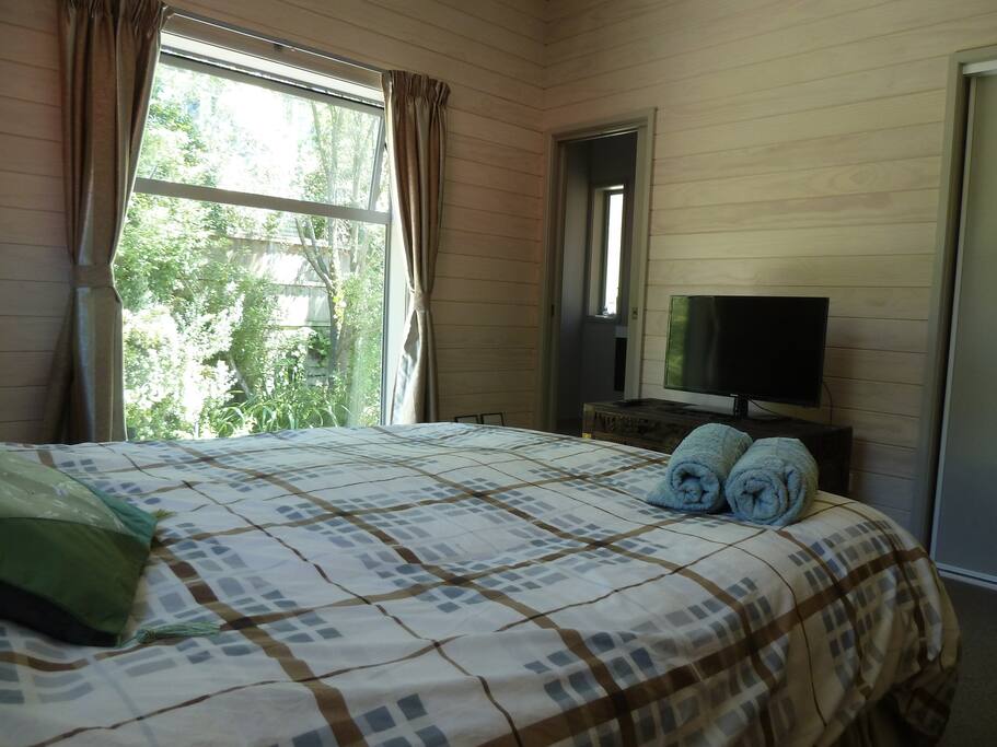 Master bedroom with ensuite & TV