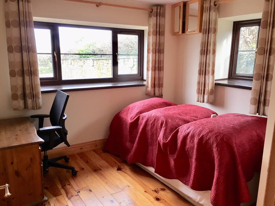 Downstairs bedroom with double/two singles