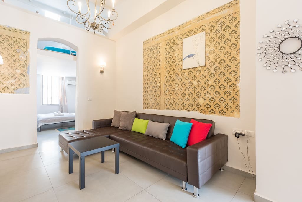 Spacious Living room with high ceilings and TV screen