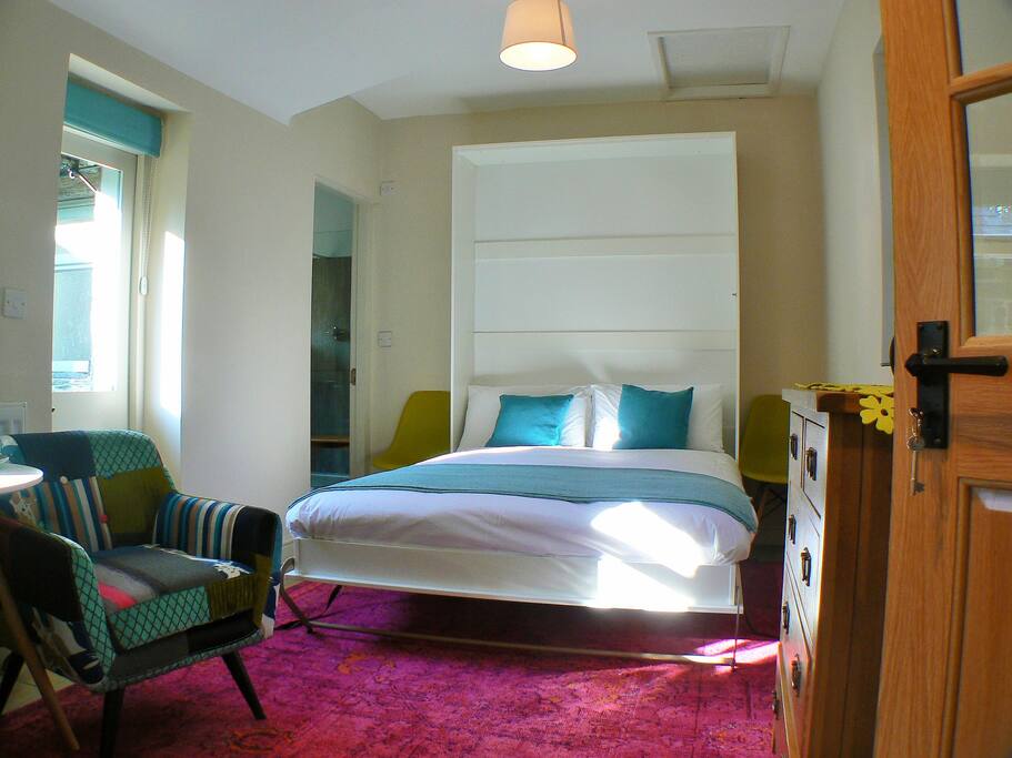 The wall bed can be folded away when not needed