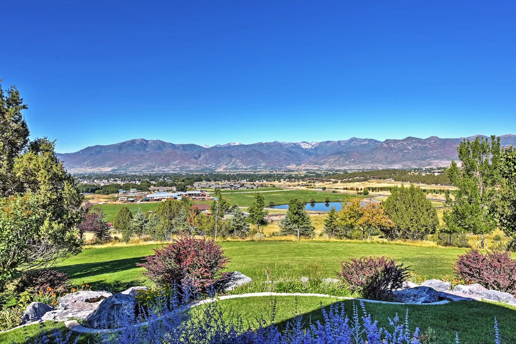 The expansive property is surrounded by breathtaking mountain views.