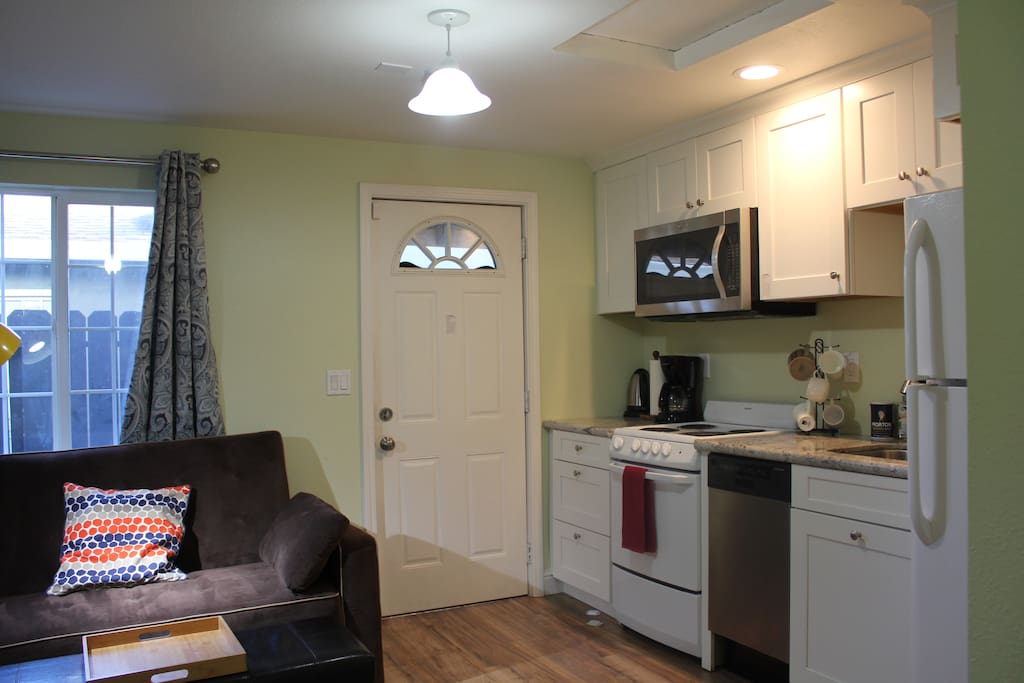 24 hours check-in. Entrance door leads into this living room with kitchen