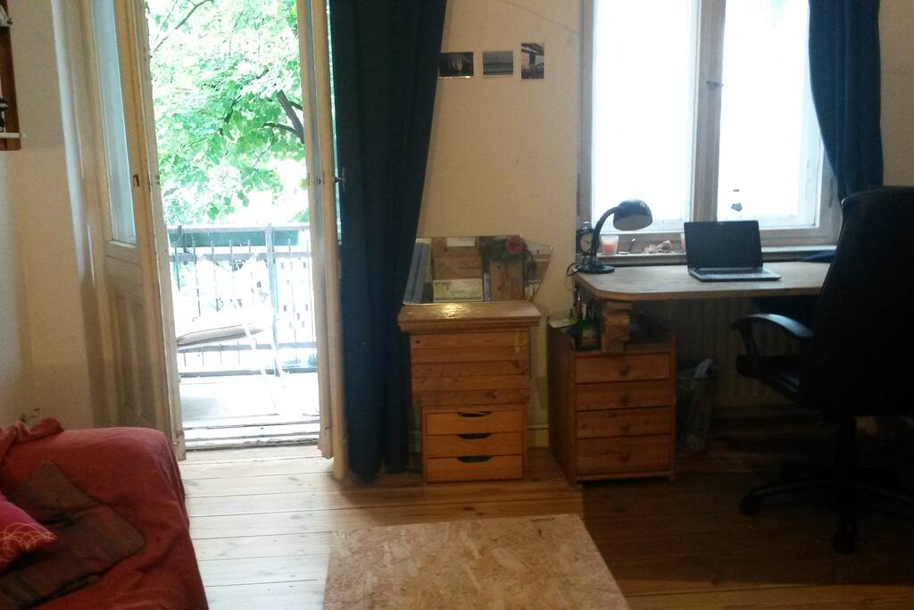 High ceilings, high windows hardwood floor and the desk.