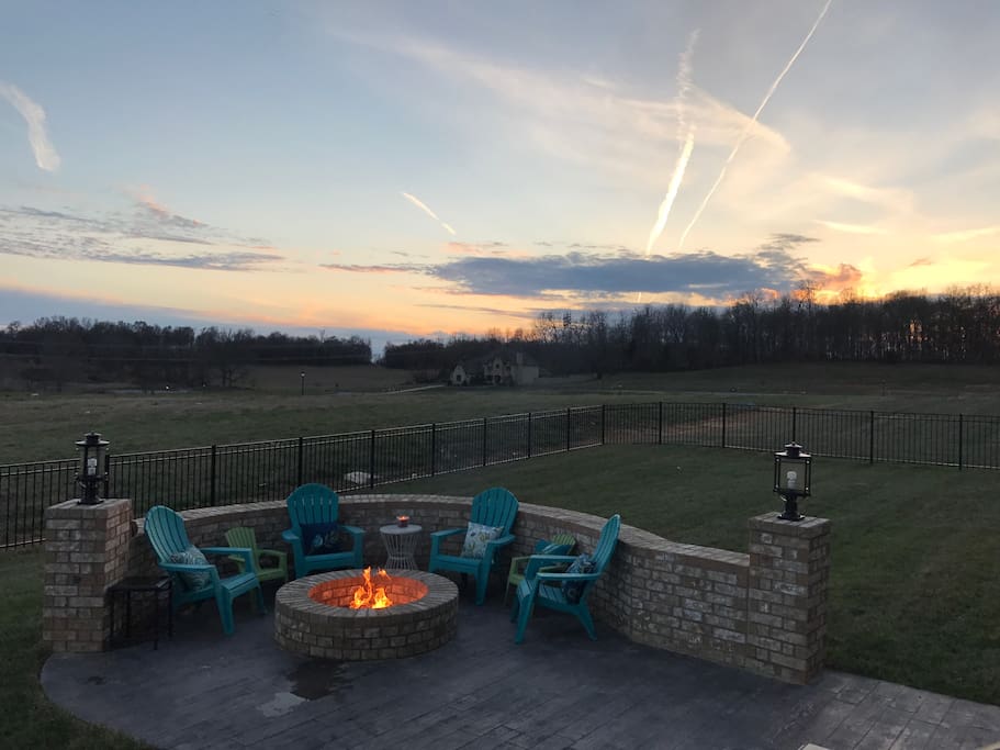 Backyard patio with fire pit and grill