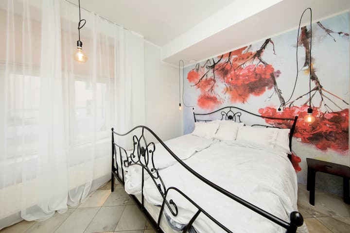 Second bedroom with a beautiful rowan wall. Kingsized bed.