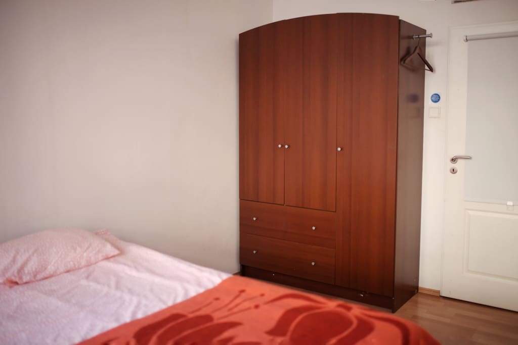 Airy light comfortable room with big wardrobe. Towels provided.