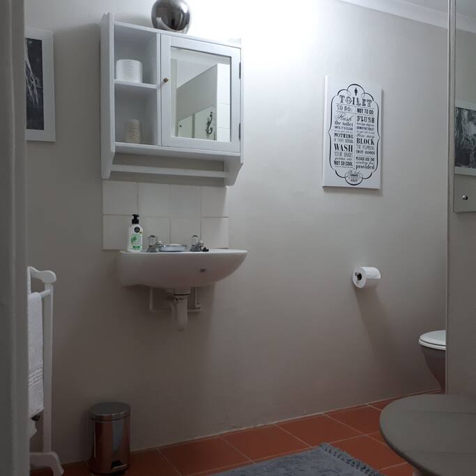Clean modern bathroom with shower.