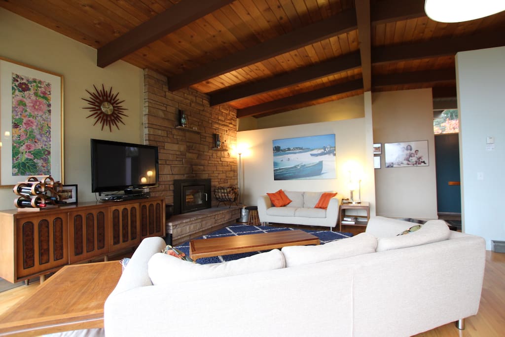 Large living room with comfy couches, large TV with Netflix and DVD’s, wood burning fireplace.